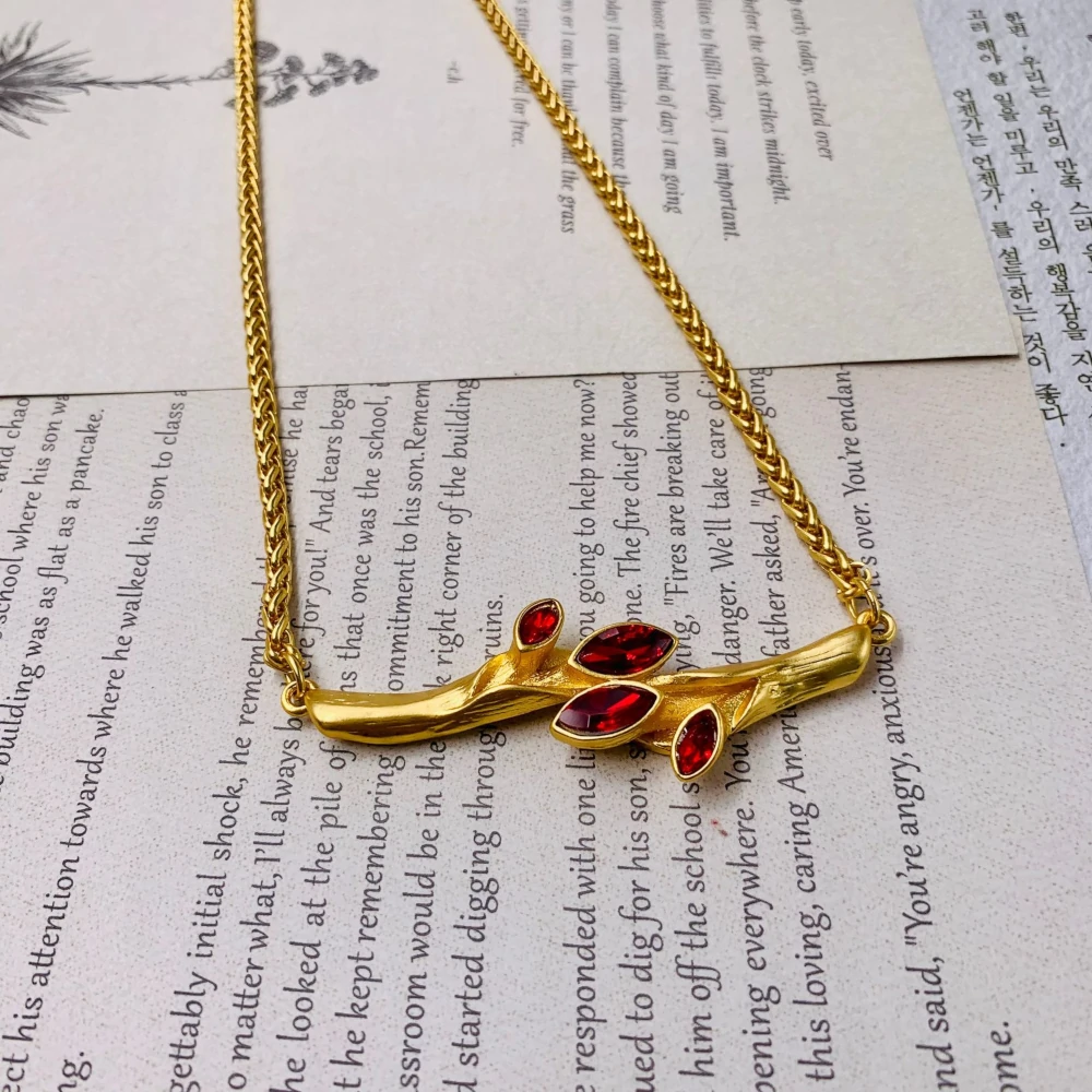 Brass electroplated real gold olive branch necklace set with dazzling ruby chaton